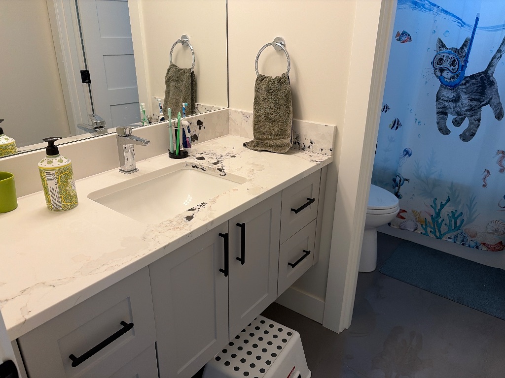 The same bathroom counter after decluttering, now clean and organized